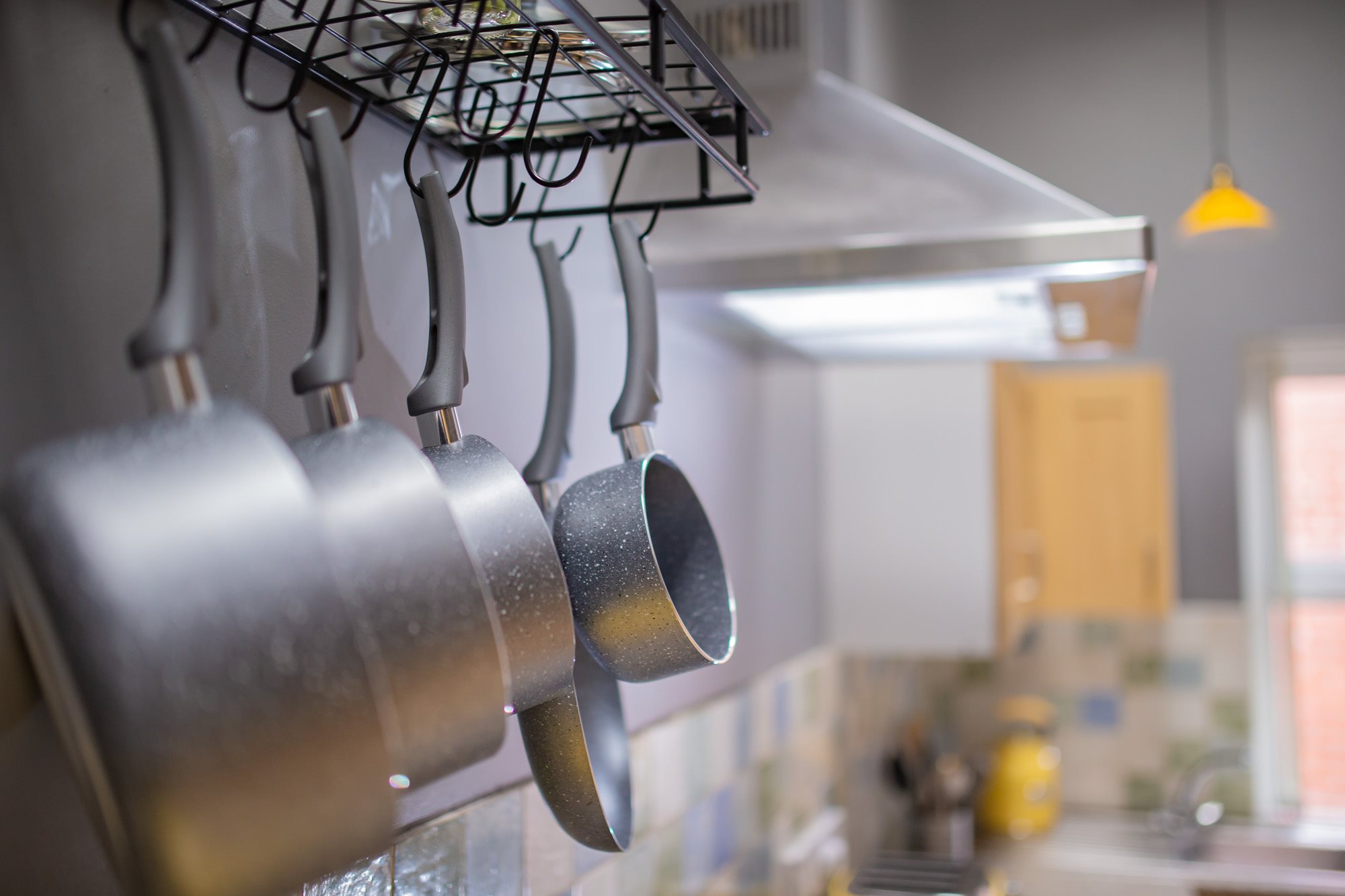 Kitchen counter and hanging cookware