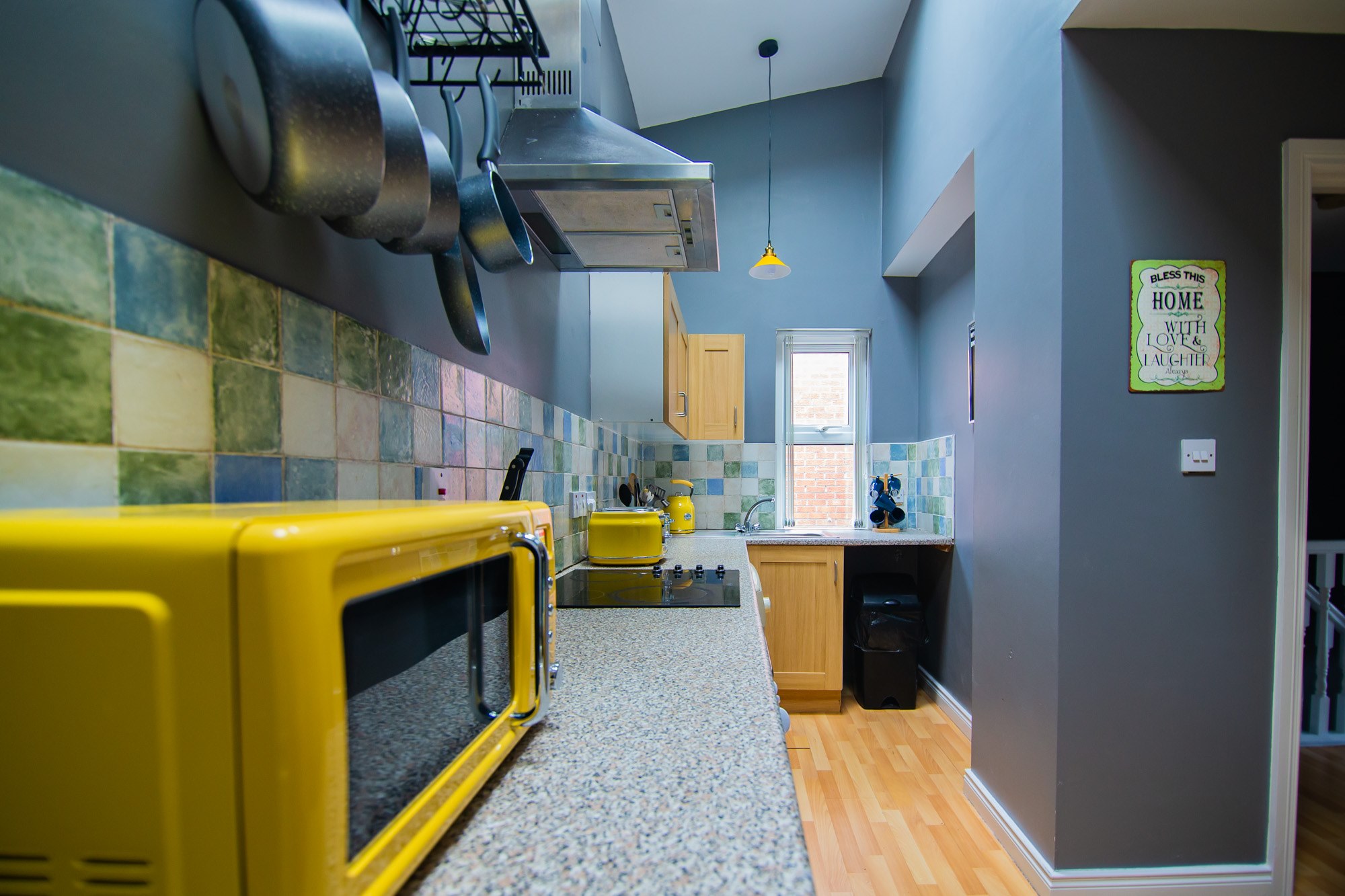Kitchen and dining room with yellow accents