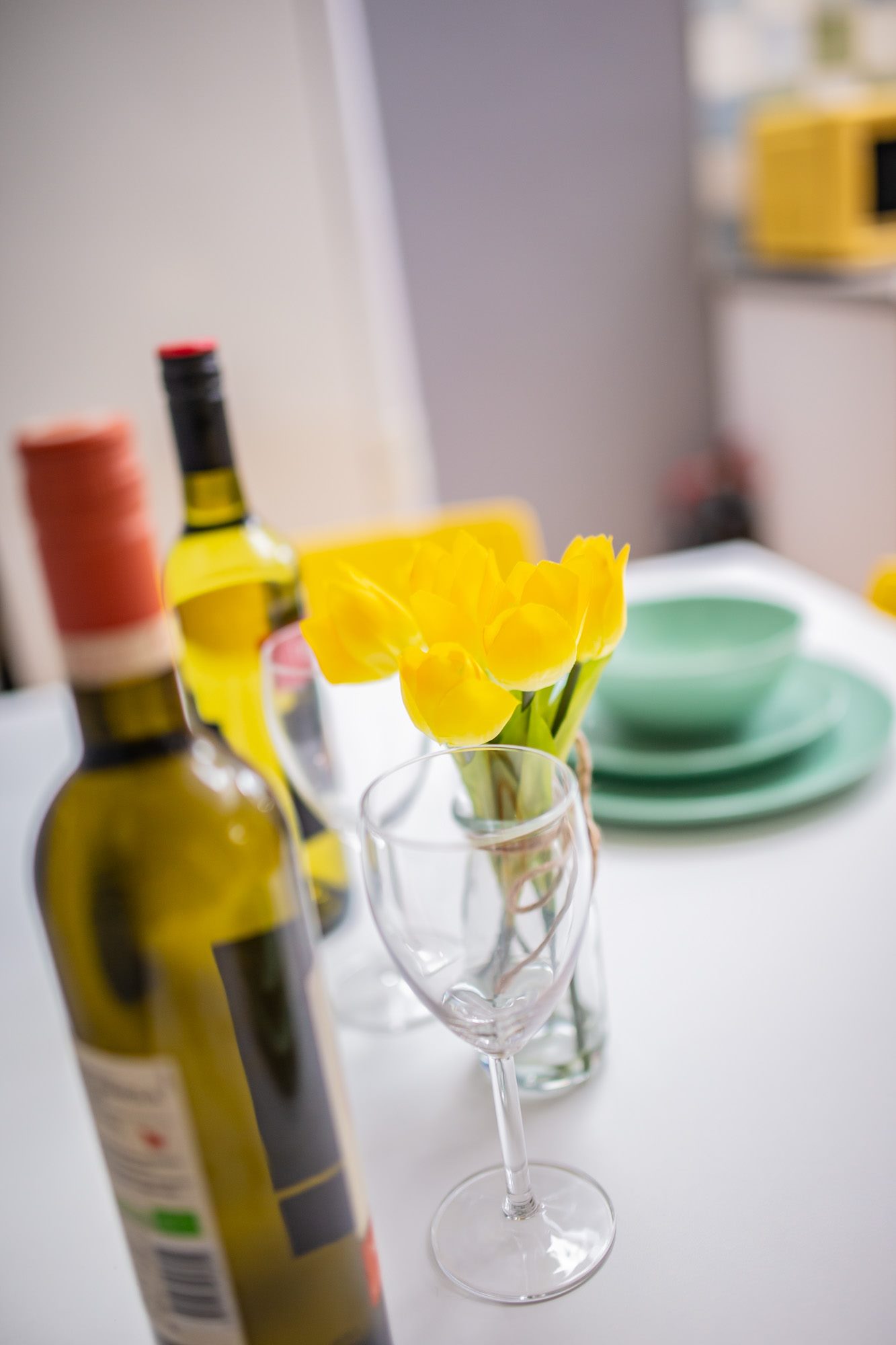Dining table set with flowers and crockery
